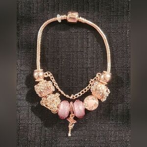 Gold and Pink Charm Bracelet with Ornate Charms. ITEM No. 19-144